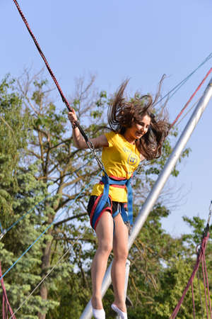 TIMISOARA, ROMANIA - May 4, 2018: university graduating students are having a photo shooting in the parkのeditorial素材