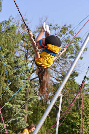 TIMISOARA, ROMANIA - May 4, 2018: university graduating students are having a photo shooting in the parkのeditorial素材