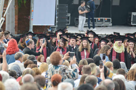 TIMISOARA, ROMANIA - June 09, 2019: university graduating students are having a photo shooting in the parkのeditorial素材