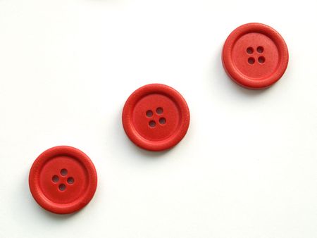 three red buttons on white backgroundの写真素材