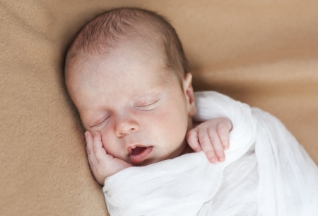cute newborn baby boy sleepingの写真素材