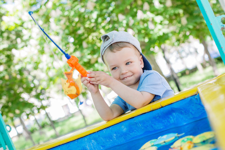 Happy Toddler boy playing in the fishingの写真素材