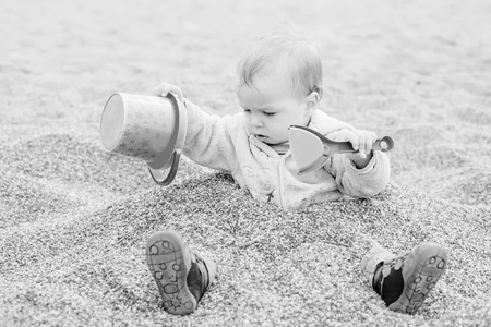 Funny toddler boy playing ( black and white )の写真素材