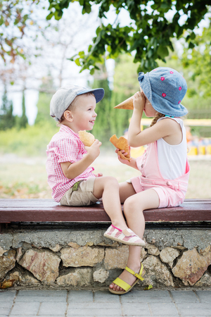 Toddler happy children playing in the parkの写真素材