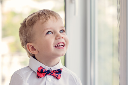 Portrait of a happy little boy with red tieの写真素材