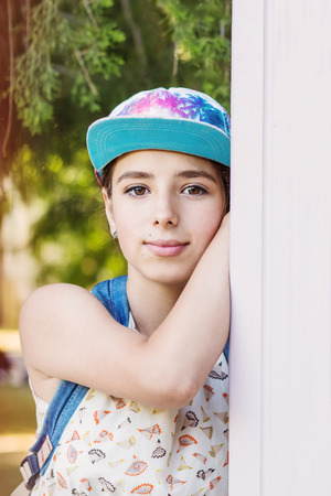 portrait of a beautiful brown-eyed teenage girl outdoorsの写真素材