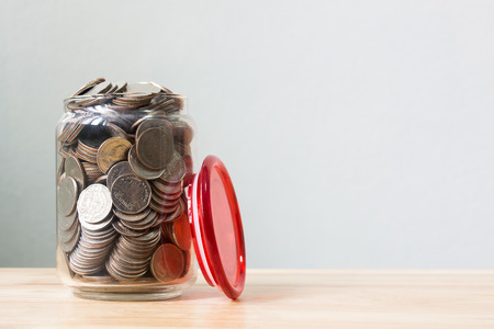 Money coin in glass bottle