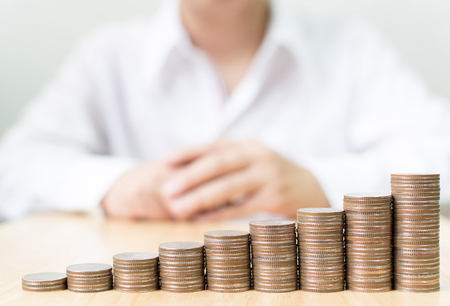 Coin stack step growing up to success financial business with businessman white shirt, Save money and investment conceptの写真素材