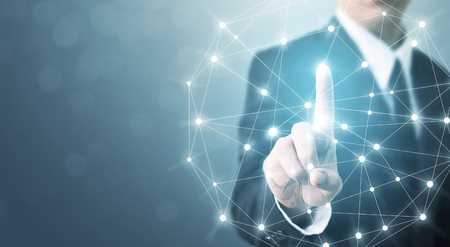 Businessman hand touching global network connection system with space for your messageの写真素材
