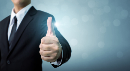 Businessman showing OK or hand sign thumb up, The excellence of the business or service concept, Copy spaceの写真素材