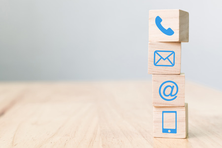 Wood block symbol telephone, mail, address and mobile phone, Website page contact us conceptの写真素材