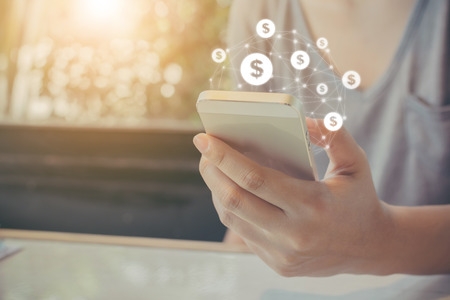 Asian woman hand using mobile phone with online transaction application, Concept ecommerce and internet investmentの写真素材
