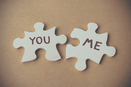 Jigsaw puzzle two pieces and wording you and me, Concept lover and international valentine dayの写真素材