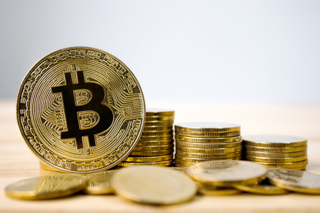 Golden bitcoin with coin stack. Future currency and business financial blockchain conceptの写真素材