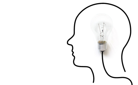 Creative thinking ideas brain innovation concept. Light bulb on white background with drawing head humanの写真素材