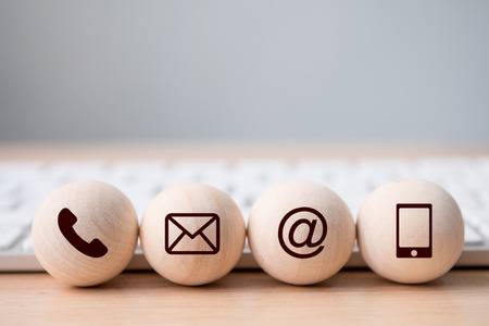 Wood sphere symbol telephone, mail, address and mobile phone. Website page contact us or e-mail marketing conceptの写真素材