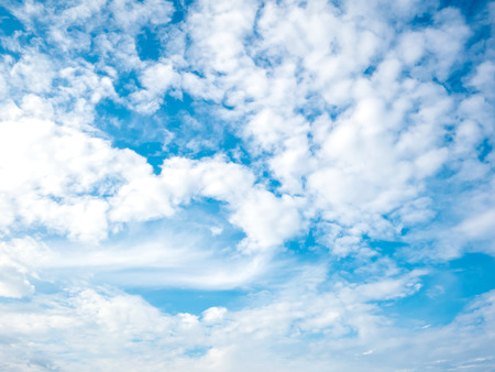 Summer time blue sky background with tiny cloudの写真素材