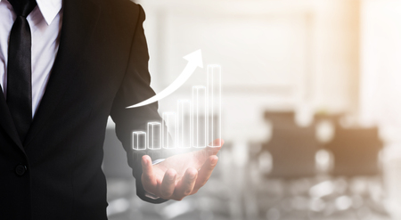 Business development to success and growing growth concept, Businessman hand holding graph corporate future growth planの写真素材