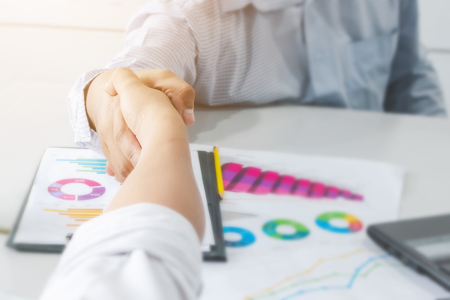 Closeup businessman handshake together partnership or teamwork conceptの写真素材