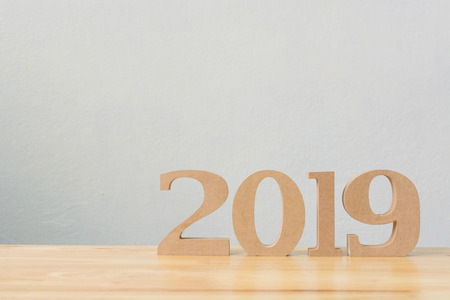 New years resolution 2019 concept. Wooden year number on table with copy space for your textの写真素材