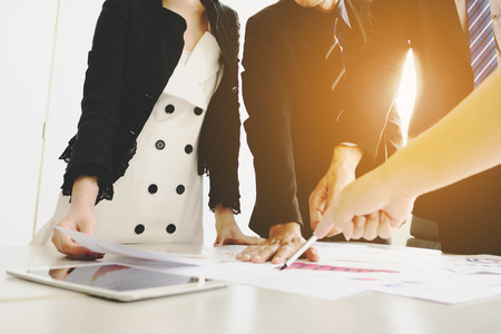 Group of businessman and businesswoman meeting analyze the company performance and growth corporate with information data paperの写真素材