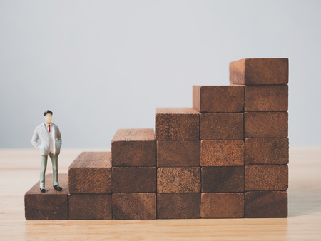 Wood block stacking as step stair. Ladder career path concept for business growth success process, Copy spaceの写真素材