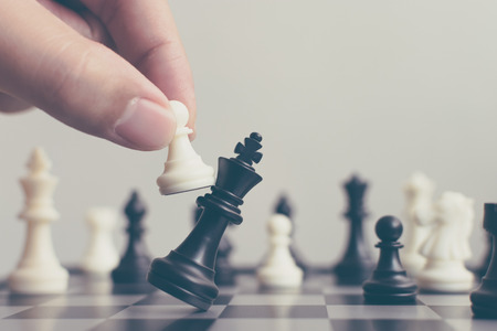 Plan leading strategy of successful business competition leader concept, Hand of player chess board game putting white pawn, Copy space for your textの写真素材