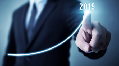 Business development to success in 2019 concept. Businessman pointing arrow graph corporate future growth planの写真素材