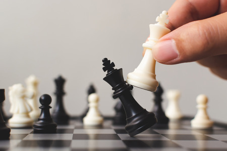 Plan leading strategy of successful business competition leader concept, Hand of player chess board game putting white pawn, Copy space for your textの写真素材