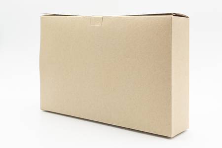 Closed blank cardboard brown box isolated on white backgroundの写真素材
