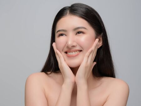 Beautiful young woman asian with clean perfect skin. Portrait model natural make up. Spa, skincare and health wellnessの写真素材