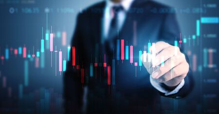 Double exposure businessman pointing line dot graph. Technical price candlestick chart graph and indicator stock online tradingの写真素材