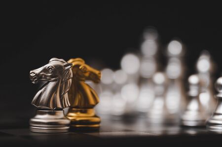 Business competition and strategy plan concept. Chess board game gold and silver colourの写真素材