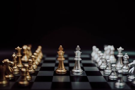 Business competition and strategy plan concept. Chess board game gold and silver colourの写真素材