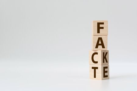 Fact or Fake concept, Wooden cube change the word, April fools dayの写真素材