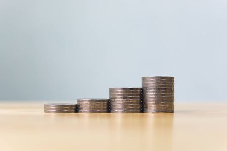 Concept save money financial business investment. Coins stack step growing growth value with copy spaceの写真素材