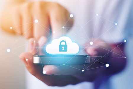 Protection cloud computing and technology network connection concept. Businessman hand holding mobile smart phone cloud server tranfer data deviceの写真素材