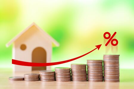 Coin stack step up graph with red arrow and percent icon, Risk management business financial and managing investment percentage interest rates conceptの写真素材