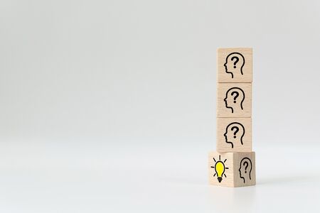 Wooden cube block flip over  with head human symbol and light bulb icon. Concept creative idea and innovationの写真素材