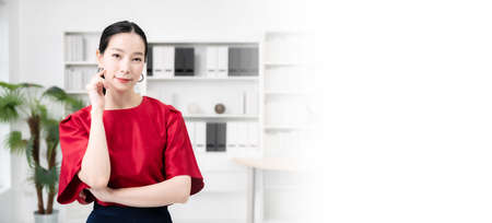 Confidence team leader. Young women asian owner startup business looking camera with smile while his...