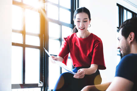 Coworking process, Corporate employees team working brainstorm project document sheet paperwork. Business startup company teamwork on meeting in modern officeの写真素材