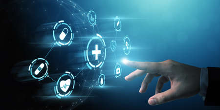 Businessman hand touching icon healthcare medical, Insurance welfare for your health conceptの写真素材