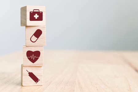 Wood block stacking with icon healthcare medical with copy space, Insurance for your health conceptの写真素材