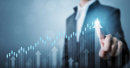 Business development to success and growing annual revenue growth concept, Businessman pointing arrow graph corporate future growth planの写真素材