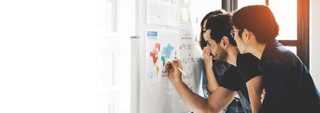 Business people meeting workshop at office and use post it notes to share idea. Brainstorming and...
