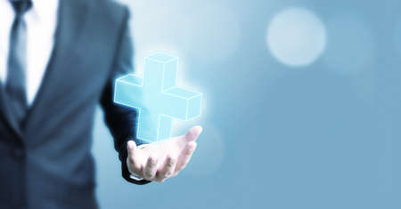 Businessman offer positive thing (such as profit, benefits, development, CSR) represented by plus signの写真素材