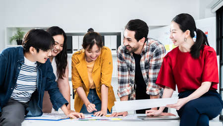 Coworking process, Corporate employees team working brainstorm project document sheet paperwork. Business startup company teamwork on meeting in modern officeの写真素材