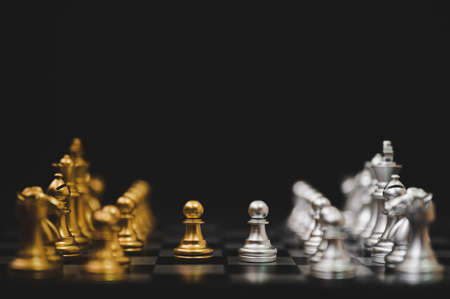 Business competition and strategy plan concept. Chess board game gold and silver colour
