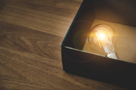 Light bulb in the black box. Concept of inspiration creative idea thinking and future technology innovationの写真素材