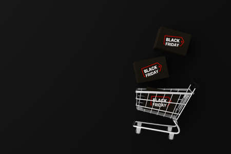 Top view of shopping cart and package box on black background. Black friday shopping festival concept. 3d renderingの写真素材